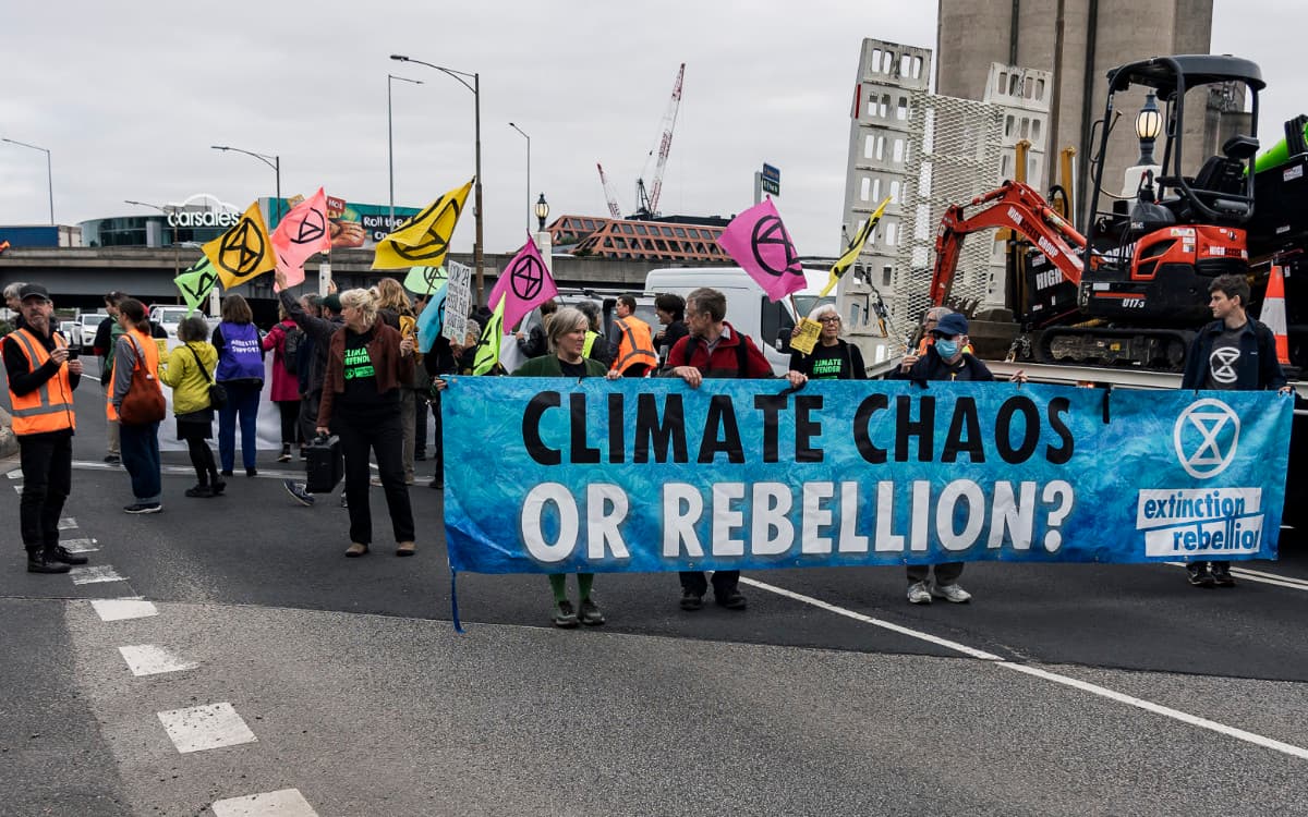 Slow Marchers with banner reading 'Climate Chaos or Rebellion?'