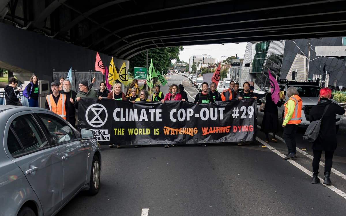 Slow Marchers with banner reading 'Climate Cop-out'