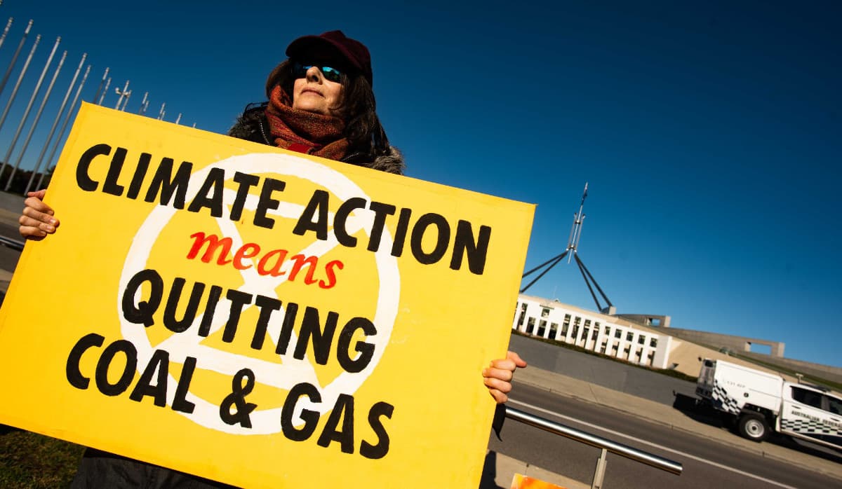 Protester with a climate action sign