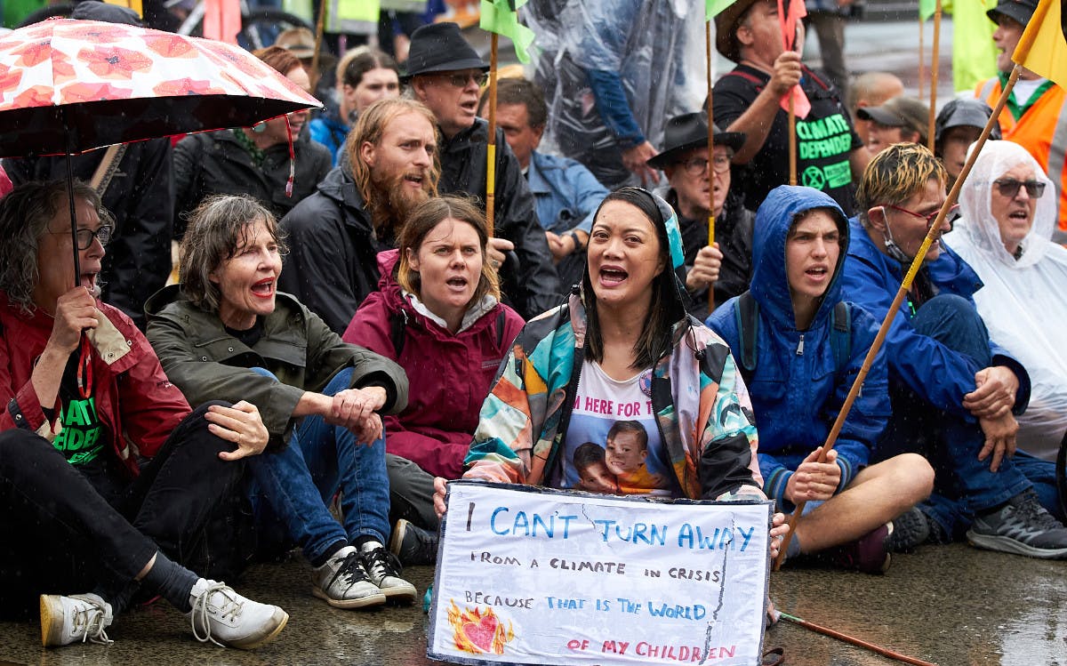 Rebels in the rain at Flinders Street. A display of mass civil disobedience. Credit: Danielle Judd