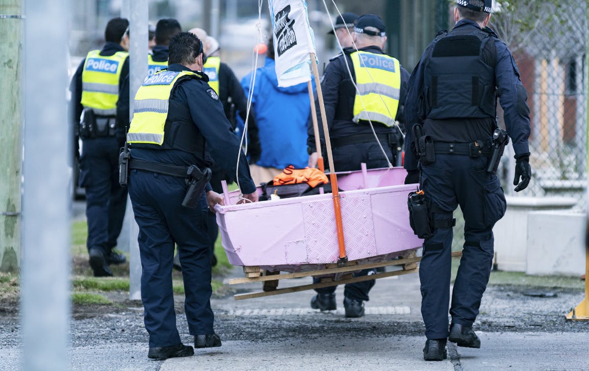XR pink boat being carried away by police