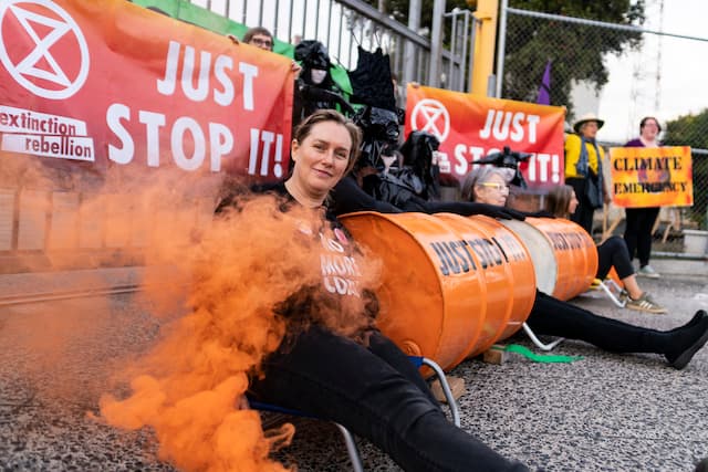 Rebels locked on to two concrete barrels at Exxon Mobil Yarraville