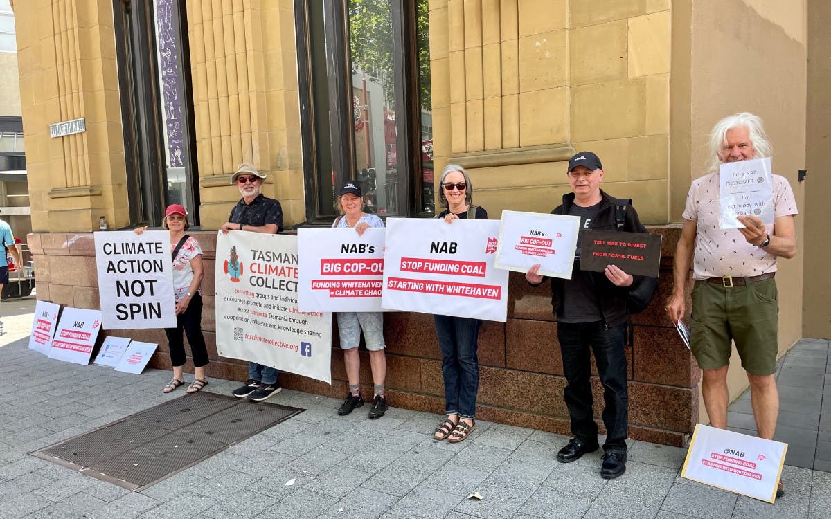 Activists gather outside the NAB HQ in Hobart