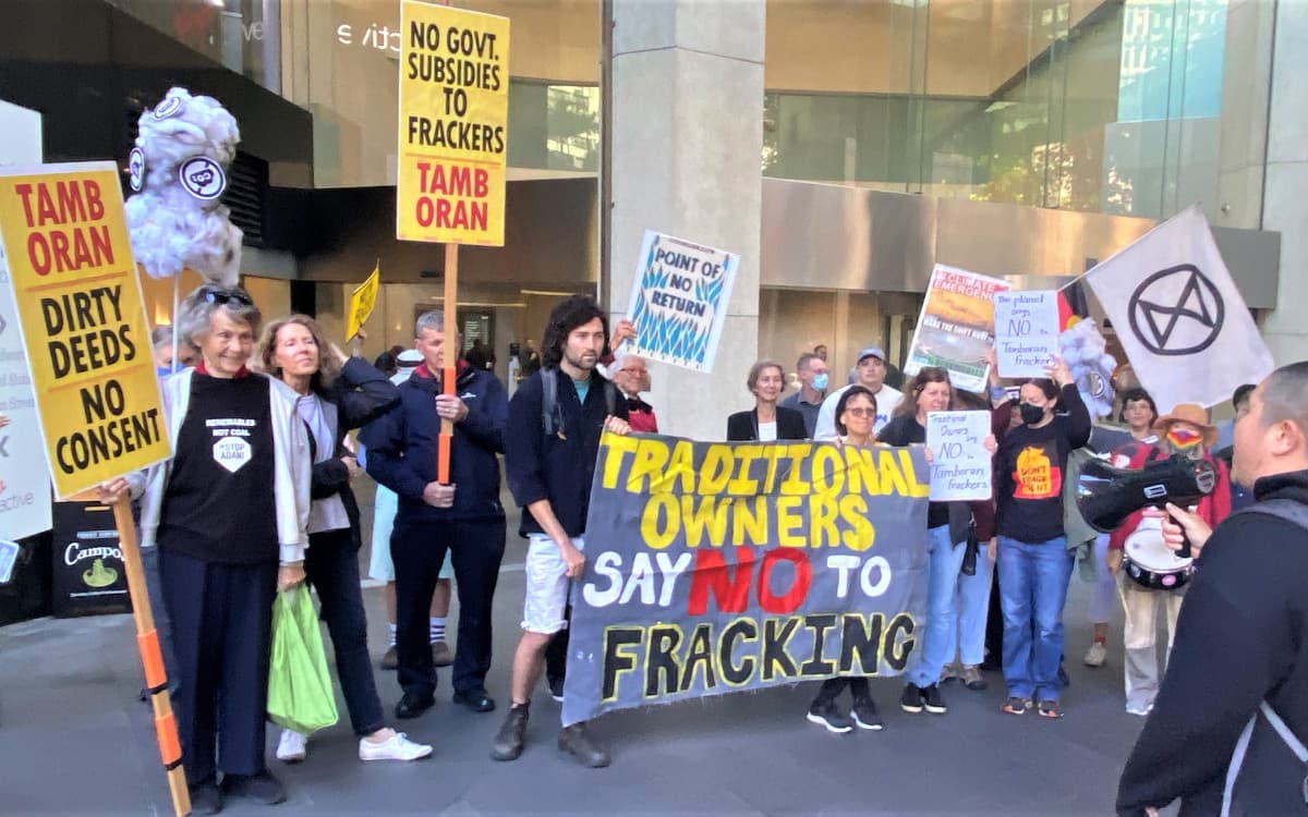 Signs about Tamboran at climate rally