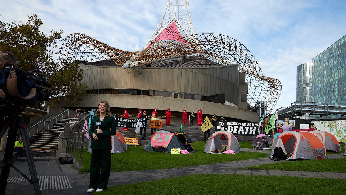 Tents occupying the Arts Centre Gardens and giant pink banner on the spire in the lead up to O4C