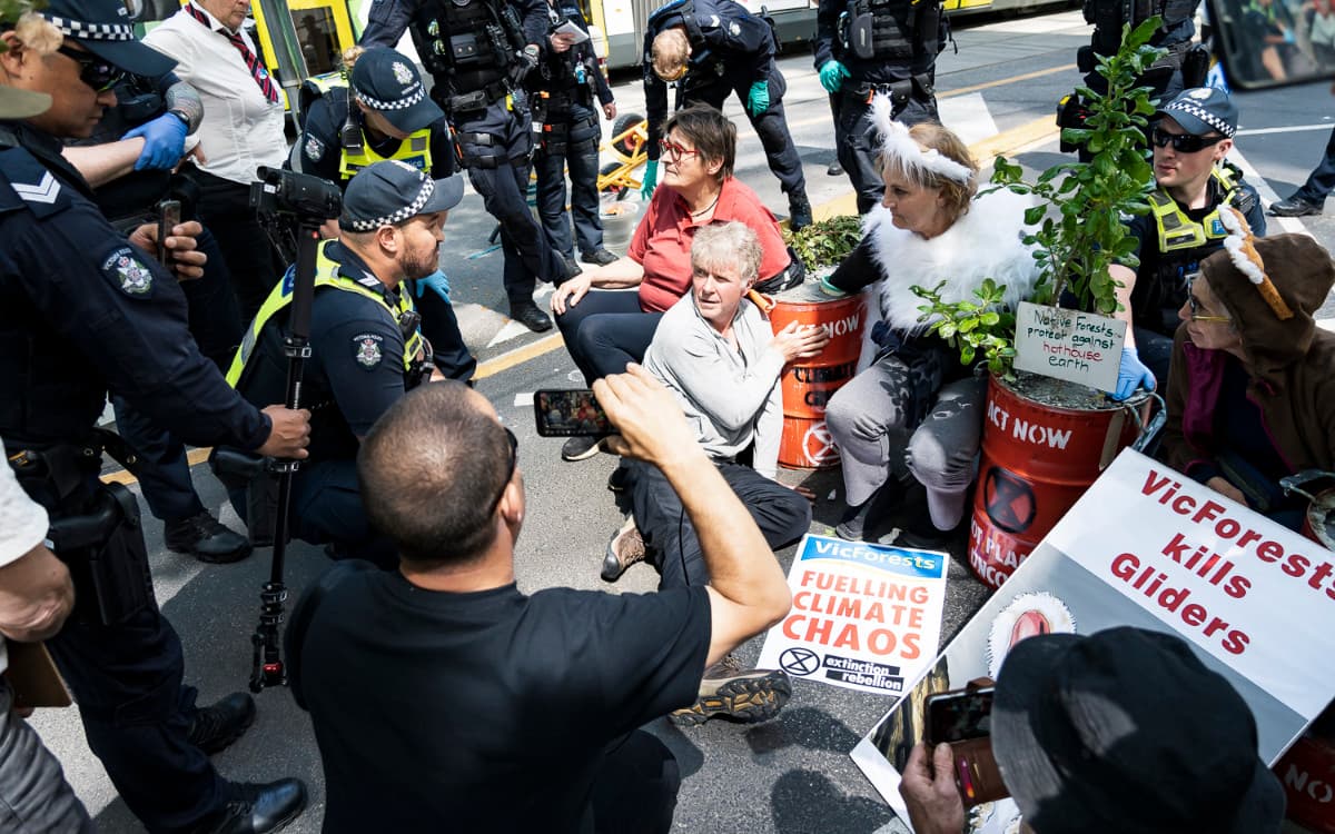 Climate and forest protesters locked on to concrete-filled barrels