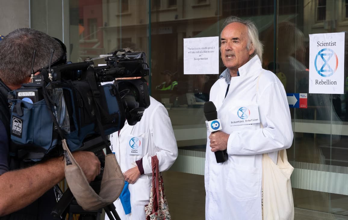 Climate Researcher and Meteorologist Darren, and Ecologist Annie glued to the Santos building