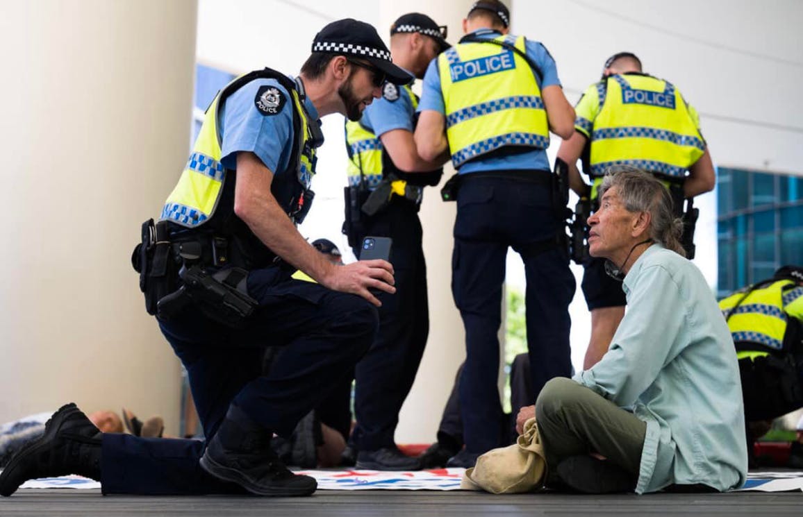Police confront XRWA Granparent protester sitting peacefully
