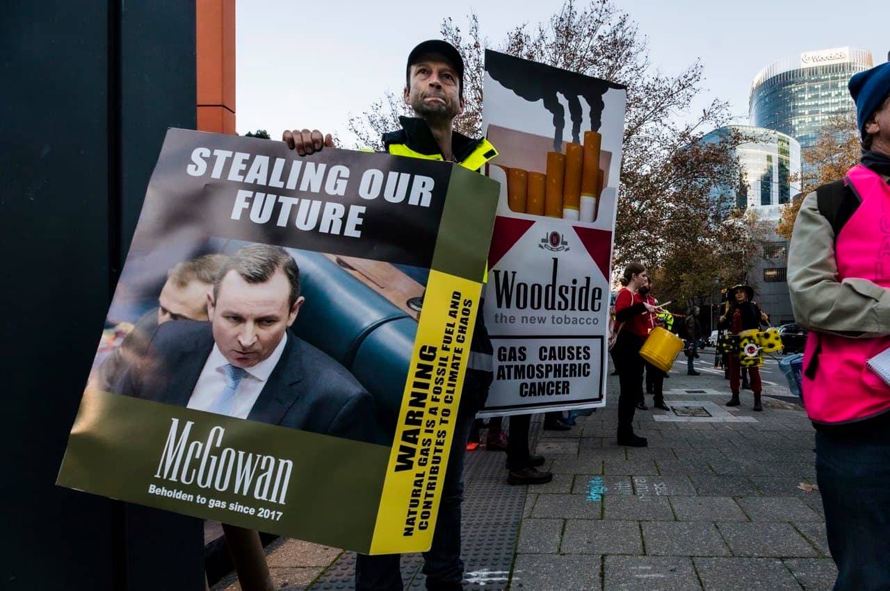 XR protestors holding banners
