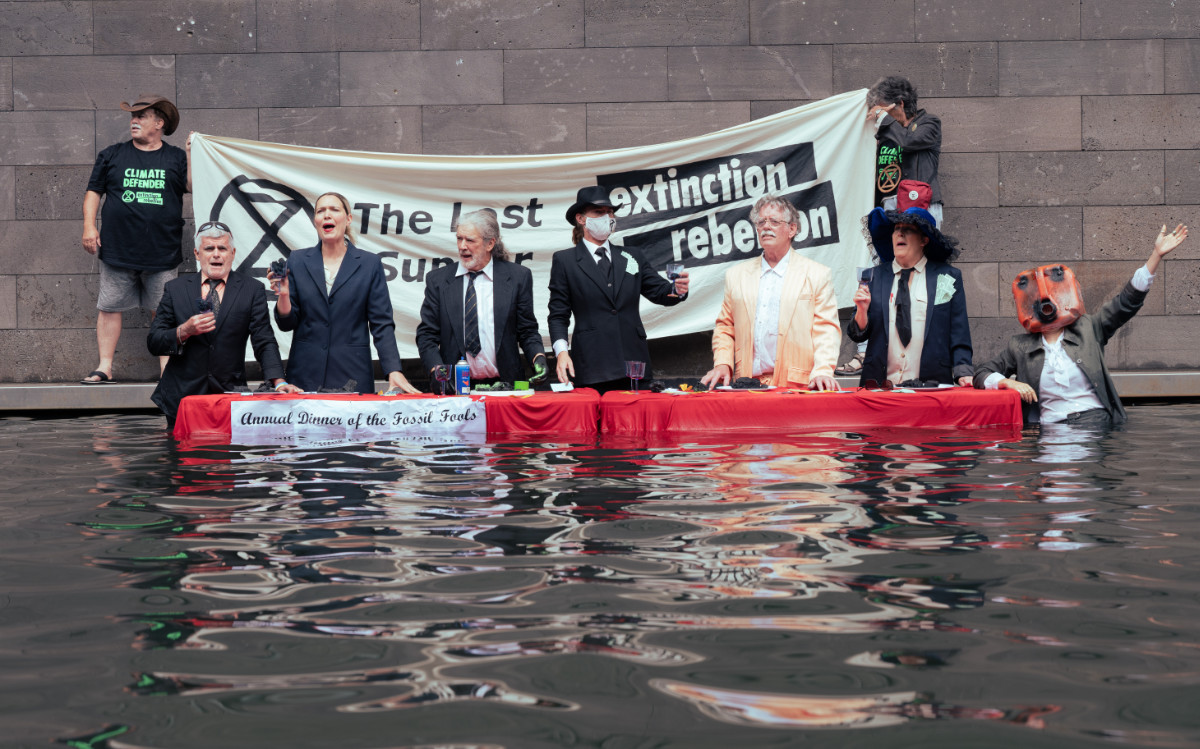 Fossil Fools enjoy a last supper outside the National Gallery of Victoria - photo by Leo Mace