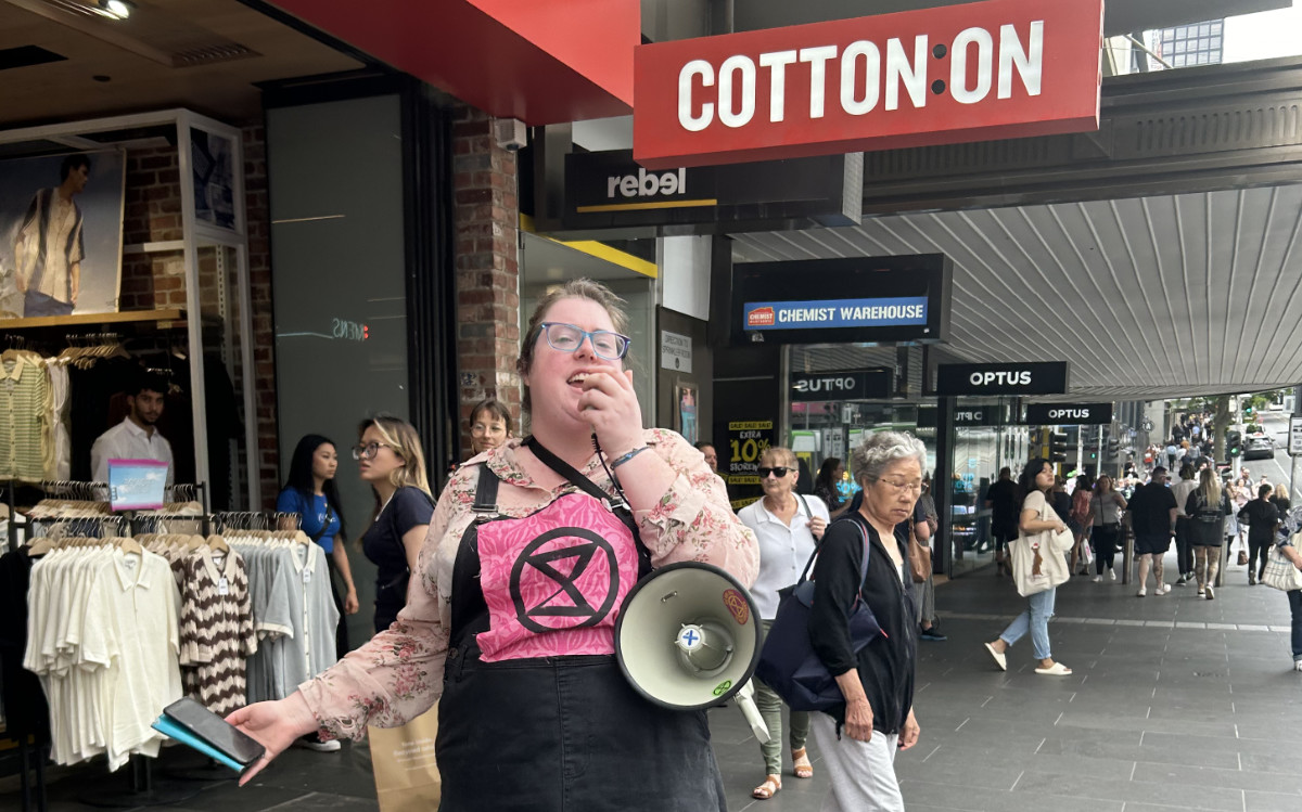 Outside the Cotton On clothing store: rebel with a loudspeaker
