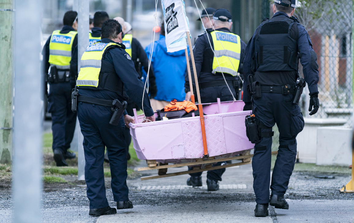 XR pink boat being carried away by police