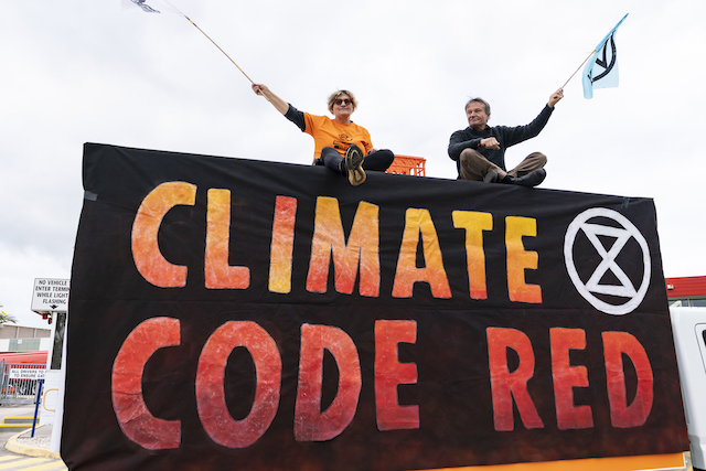 Rebels atop one of the trucks used to blockade the Ampol terminal. Photo Matt Hrcak.