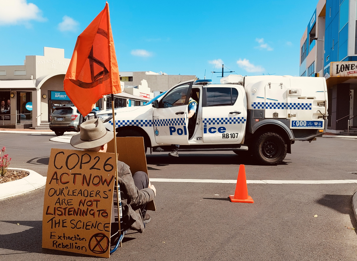 Julian blocking the road outside the office of Nola Marino MP