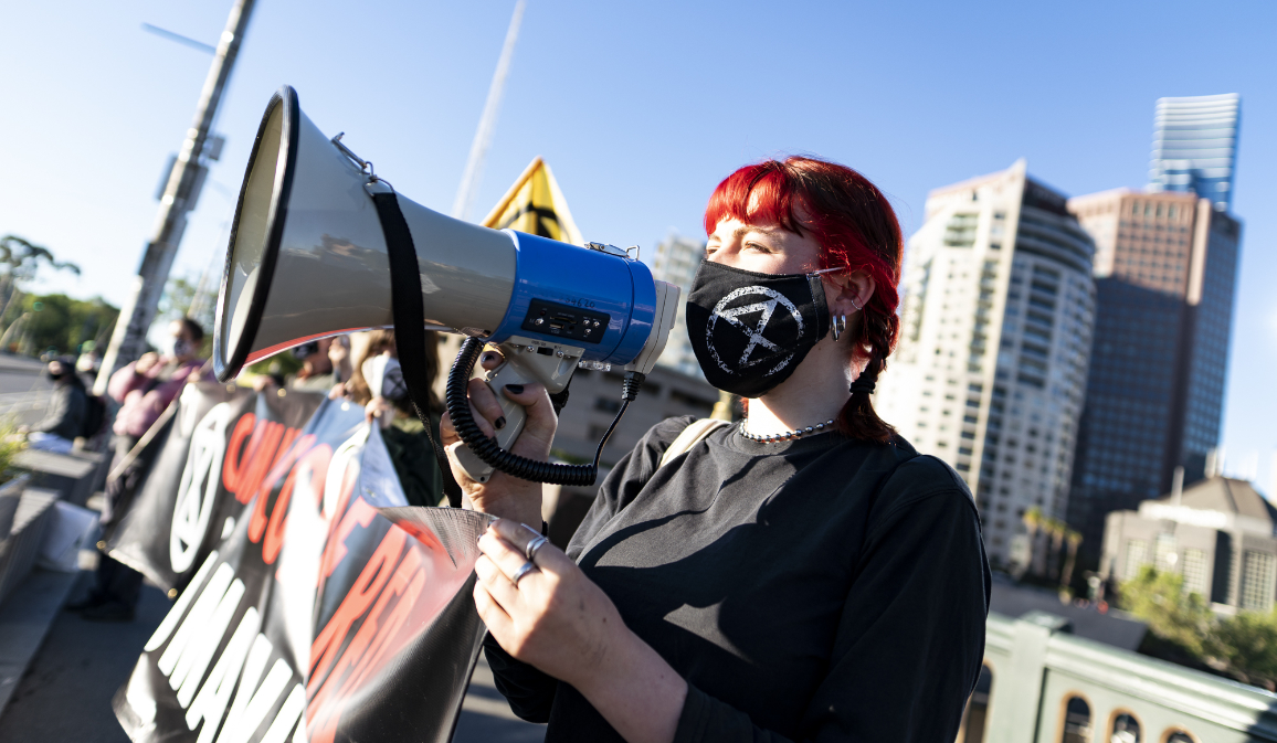 Protesters with banner and megaphone