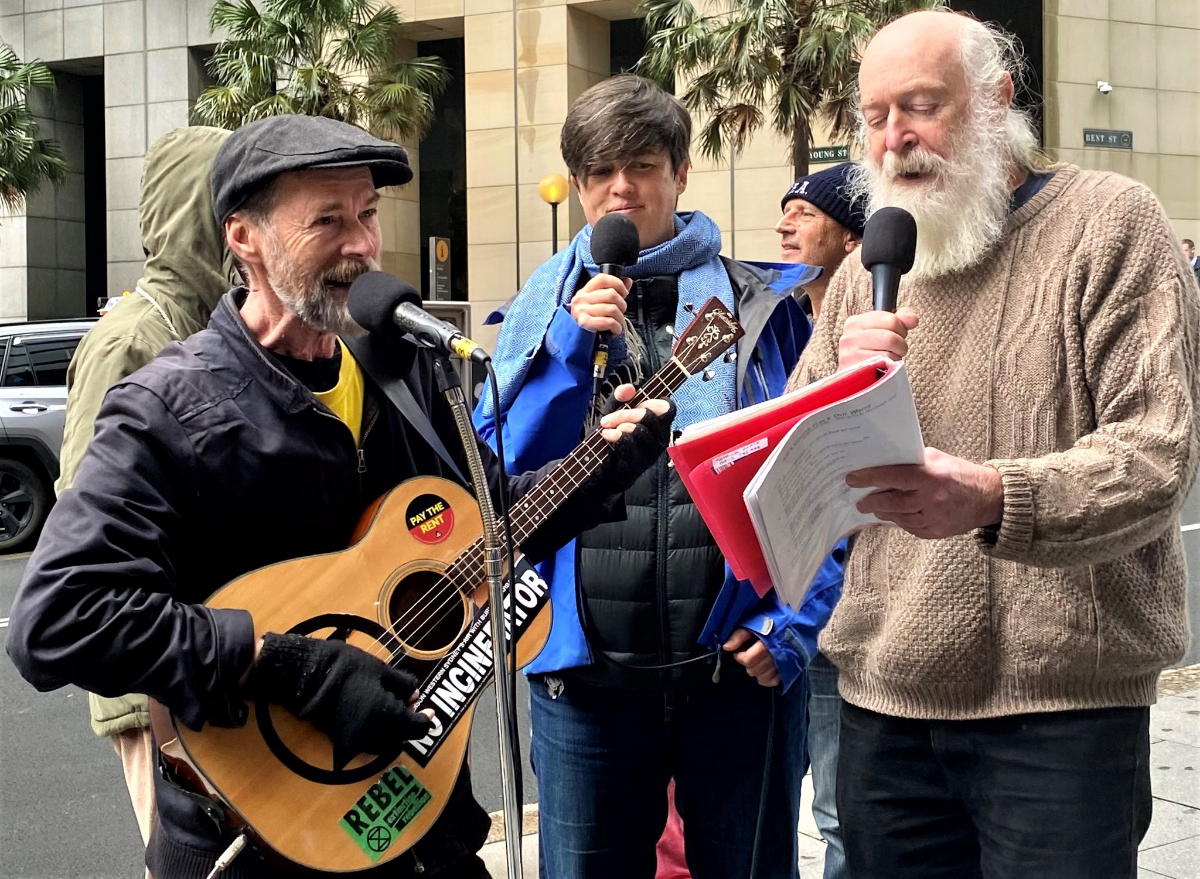 Musicians play outside the Santo Sydney HQ