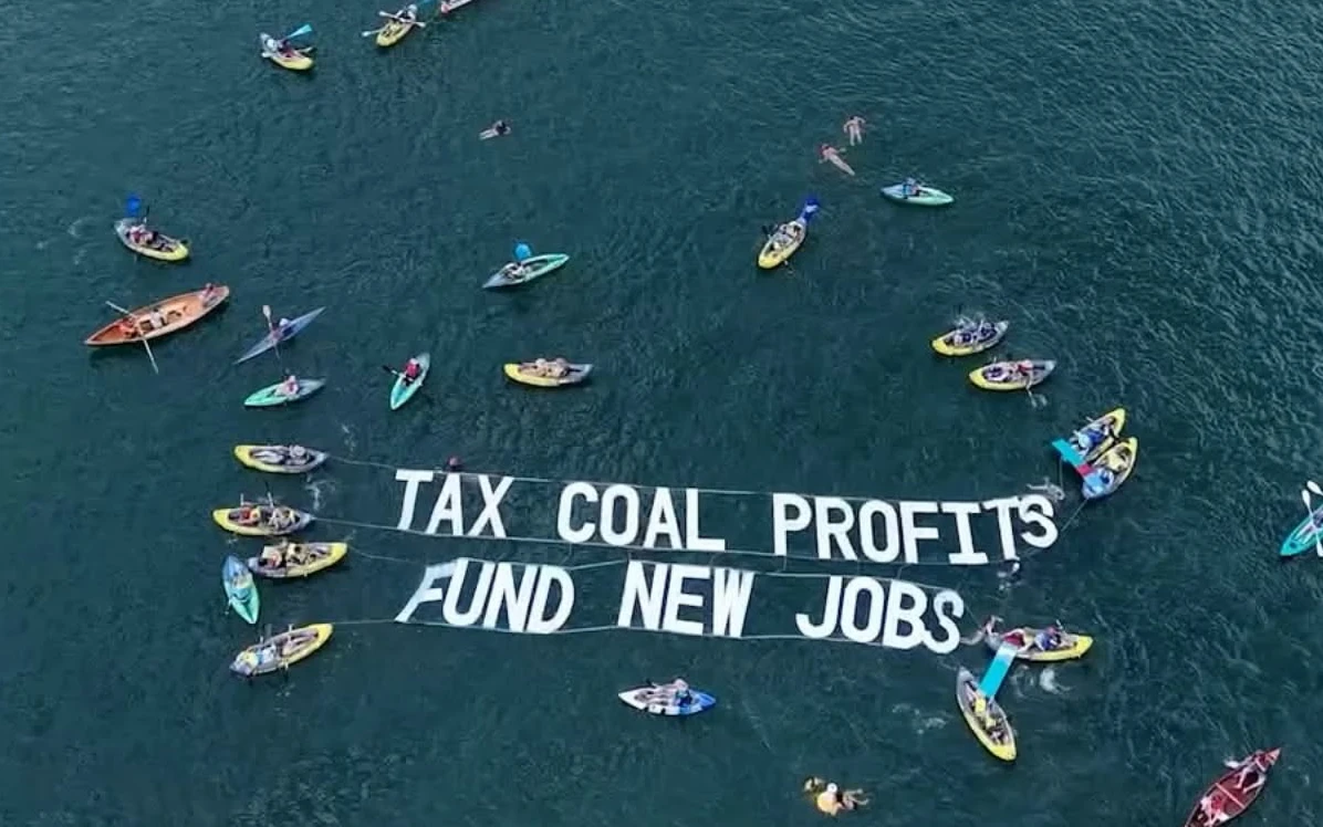 Kayaks spell out 'tax coal profits