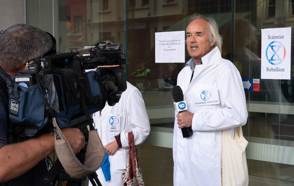 Climate Researcher and Meteorologist Darren, and Ecologist Annie glued to the Santos building
