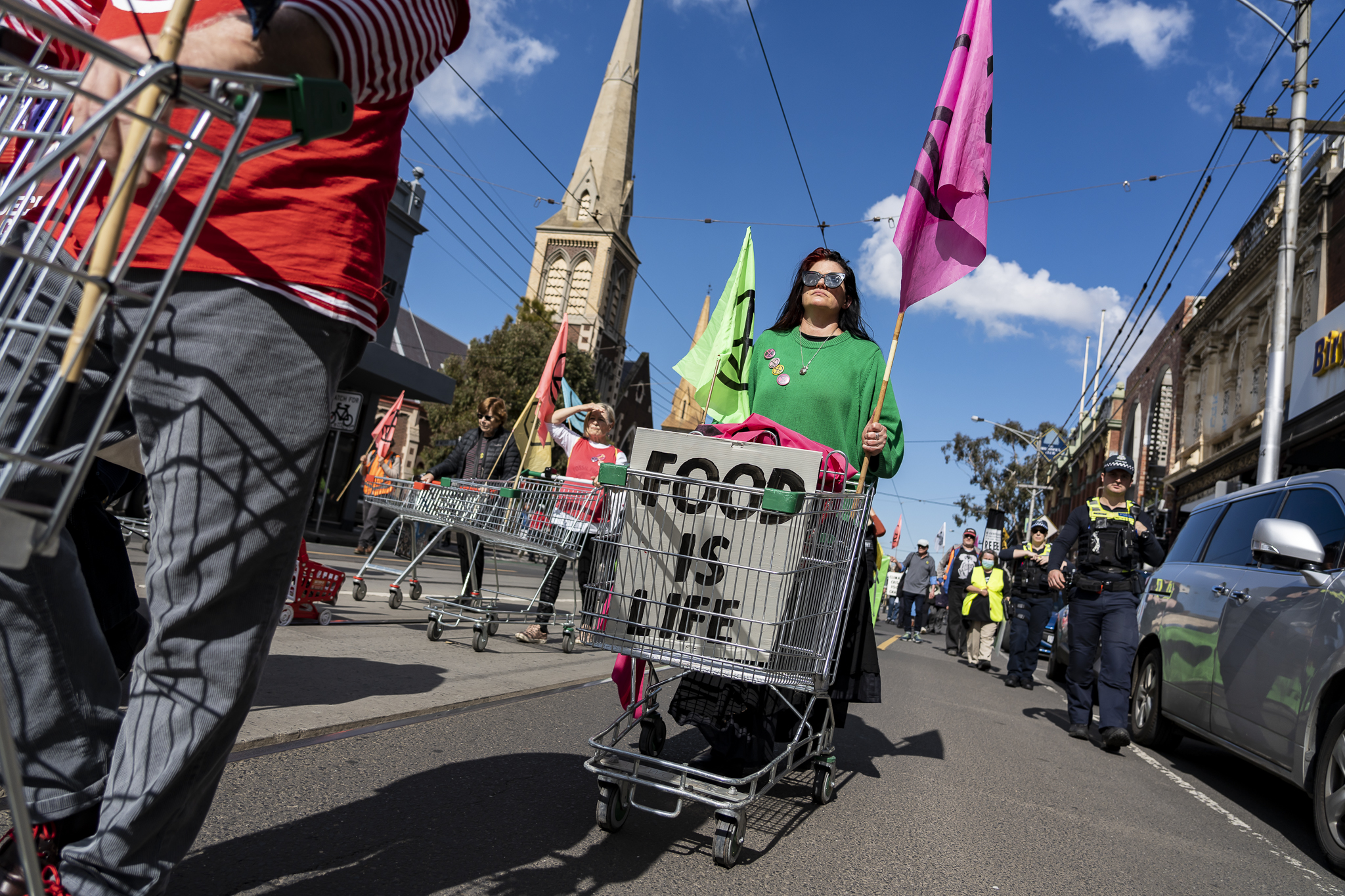 Procession of trolleys in Sydney Road, Melbourne