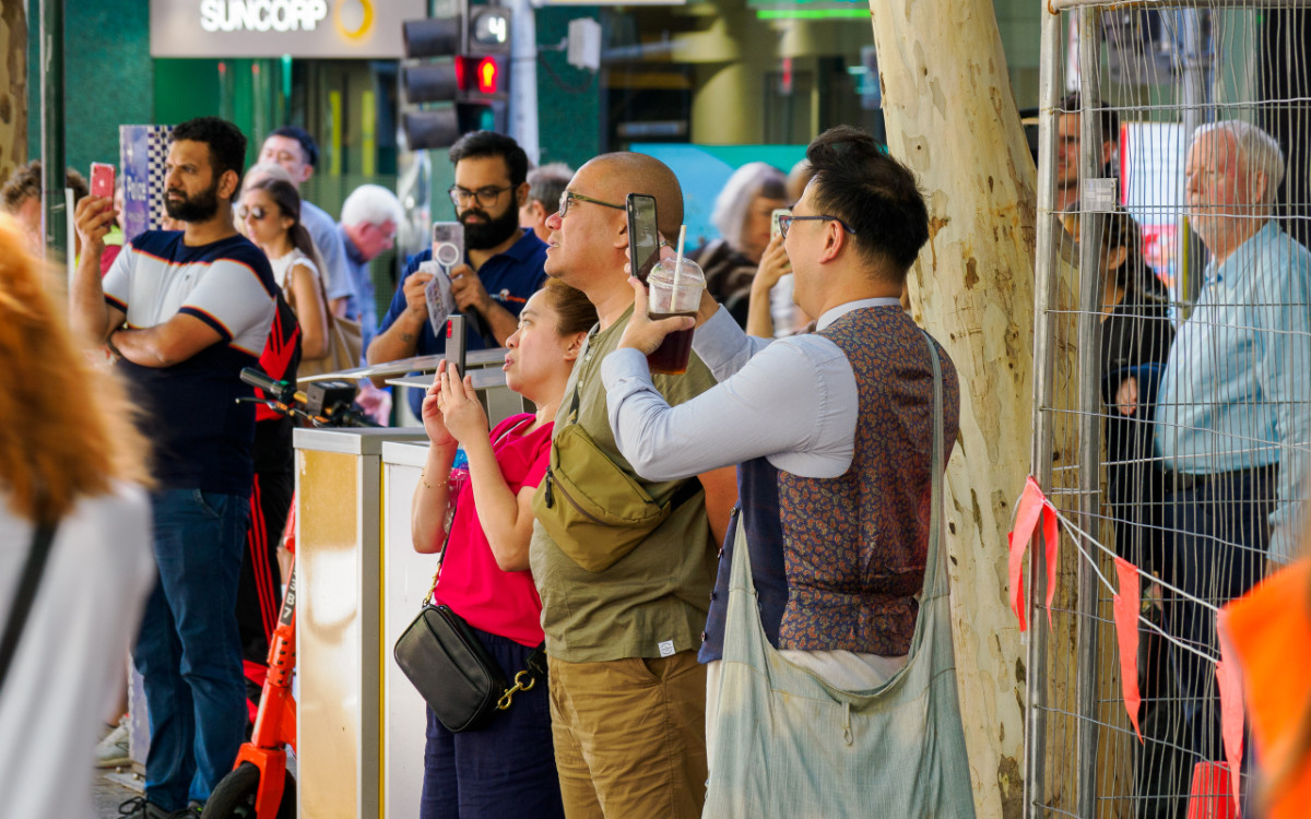 Onlookers photograph Blinky