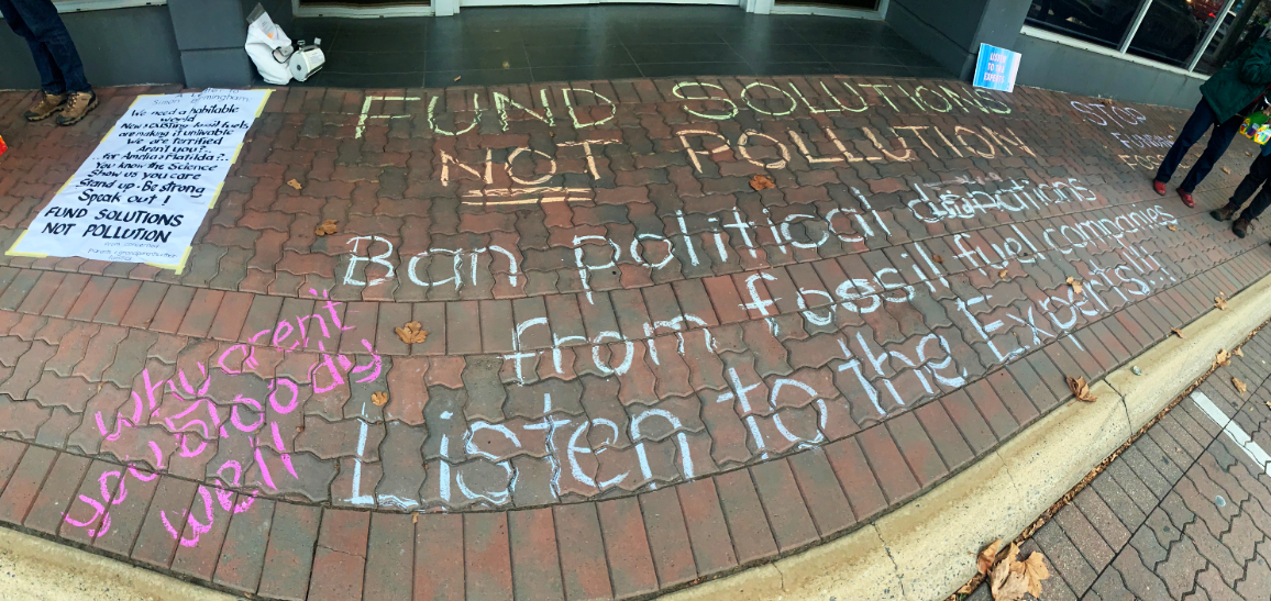 Chalking outside outside Minister Birmingham's office