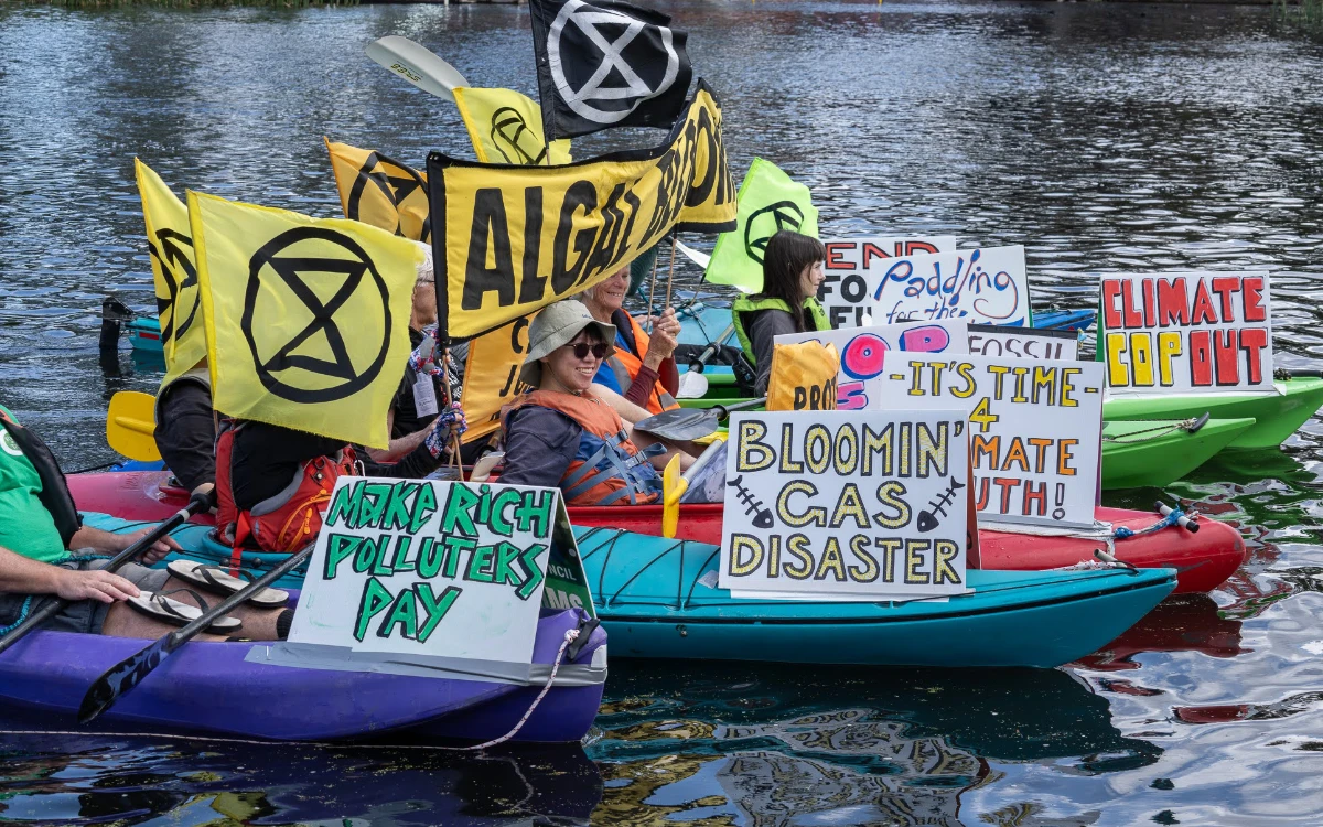 XR SA kayakers display climate protest signs