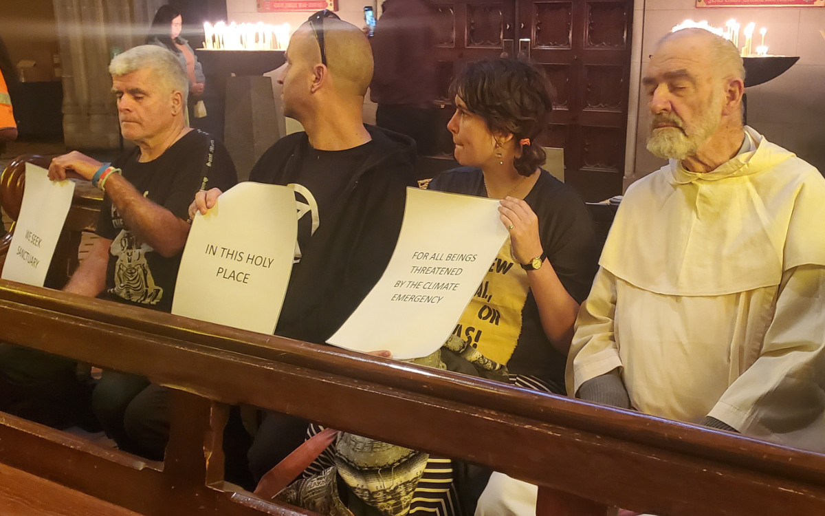 Protesters holding signs